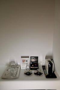 a kitchen counter with a stove top oven and appliances at Nevo Mykonos in Mikonos