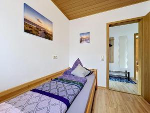 a small room with a bed and a doorway at Apartment Sirch-4 by Interhome in Diedorf