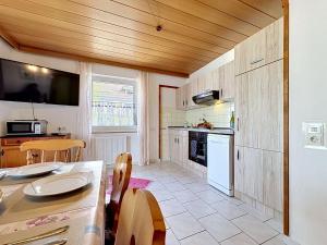 a kitchen with a table and a dining room at Apartment Sirch-4 by Interhome in Diedorf
