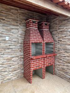 a brick brick oven in a brick wall at Apartamento Frente Mar in Jacumã