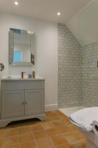 a bathroom with a sink and a mirror at The Hamptons Beach House in East Preston +23 photos