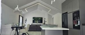 a living room with a couch and a table at ОмниЯ Терас in Chernomorets