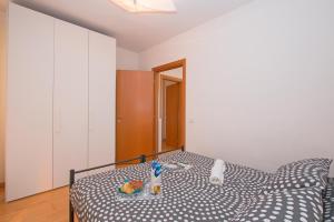 Posteľ alebo postele v izbe v ubytovaní Benacus E4 Apartment by Wonderful Italy