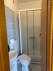a bathroom with a toilet and a sink at H&T in Senj