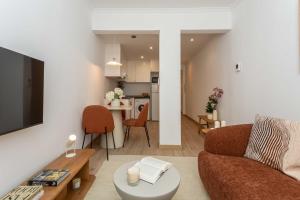 a living room with a couch and a table at Barbieri III in Madrid