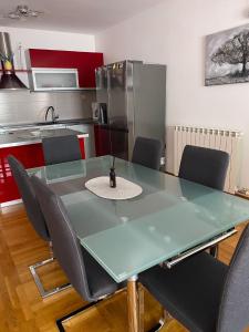 a kitchen with a table and chairs in a room at H&T in Senj +25 photos