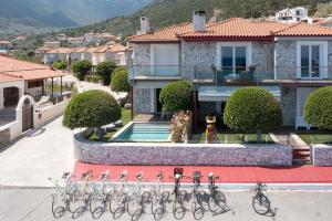 a group of bikes parked in front of a house at Tyros Boutique Houses Villas in Tyros