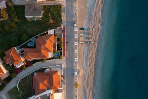 an aerial view of a beach and the ocean at Tyros Boutique Houses Villas in Tyros +49 photos