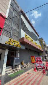 a hotel with a hotel entrance with orange traffic cones at Hotel Aura Avenue in Bathinda