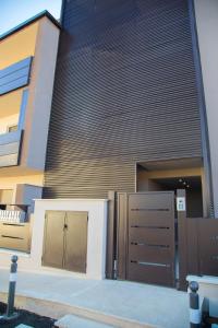 a building with two garage doors in front of it at Umbra Living in Bastia Umbra