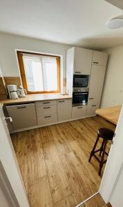 a kitchen with a table and a window at Ferienhaus Ma-inz in Stadl an der Mur