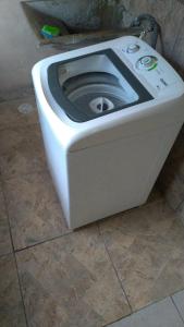 a white toilet sitting on the floor in a bathroom at Bella Serra in Iporanga
