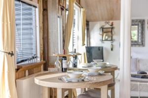 a room with a table with bowls on it at 1 Bed in Totnes oc-bc1000 in Totnes +26 photos