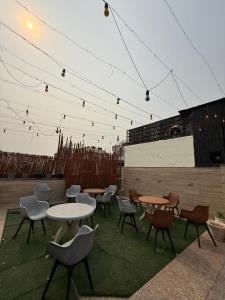 a group of tables and chairs on a patio at Aura Grand Amritsar in Amritsar