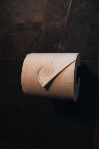 a roll of toilet paper with a napkin on it at Panorama Glass Lodge SOUTH in Hella