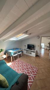 a living room with a couch and a table at Sebino Holiday Home Monteisola in Monte Isola
