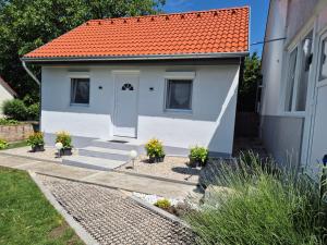 a small house with an orange roof at Auszeit in Balatonmagyaród