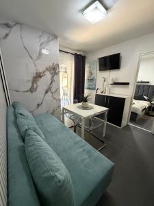 a living room with a couch and a table at Holiday Home Orsag in Drage