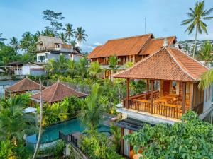 an aerial view of a resort with a swimming pool at The Dura Ubud in Ubud
