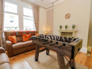 a living room with a foosball table at 163 Manchester Road in Accrington