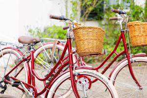 two red bikes parked next to each other with baskets at The Station House Hotel in Kilmessan
