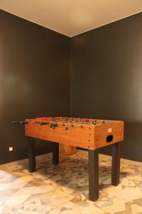 a wooden table in a room with at Hostel in Böhlen