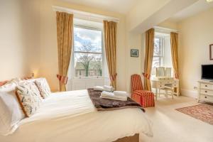 a bedroom with a large bed and a window at 2 Bed in Beadnell oc-4641 in Beadnell