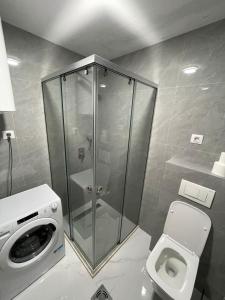 a shower stall in a bathroom with a toilet at Bluvera in Šušanj +24 photos
