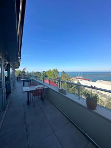 a balcony of a building with a table and chairs at Ganita Life Hotel in Trabzon