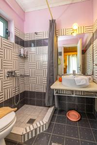 a bathroom with a sink and a toilet at Villa Kirki Apartments in Agia Effimia +47 photos