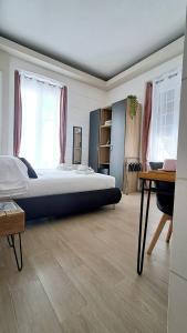 a bedroom with a large bed and a desk at La Siesta 5 terre in La Spezia