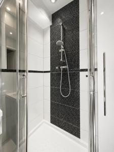 a bathroom with a shower with a glass door at Apartament Wisła Centrum in Wisła +16 photos