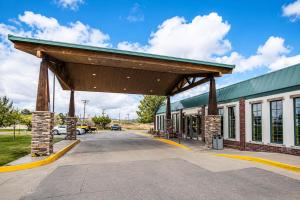 a building with awning in front of a parking lot at Motel 6 Rawlins, WY in Rawlins