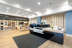a store lobby with a counter and a counter top at YourSpace Hotels Chesapeake in Chesapeake