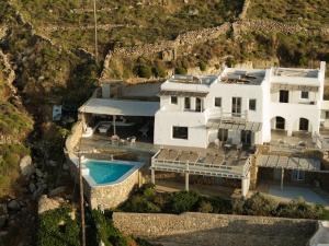 an aerial view of a large white house with a swimming pool at Villa Tonic by Mykonos Mood in Agios Ioannis Mykonos
