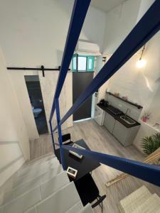 a view from the top of a staircase in a house at HomeSuite22 in Diamante +30 photos