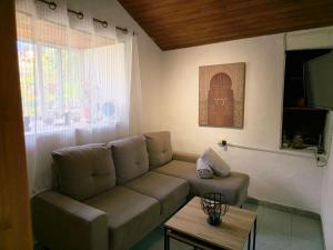 a living room with a couch and a table at Inés in Tijarafe