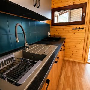 a kitchen with a sink and a sink at Domek na Orlej in Giewartów +19 photos