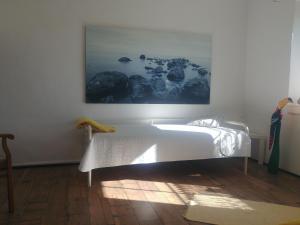 a bedroom with a bed and a painting on the wall at Forsthaus Castell in Castell