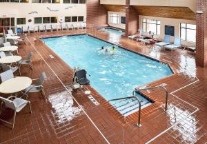 a pool in a building with people swimming in it at The Inn on Lake Superior in Duluth