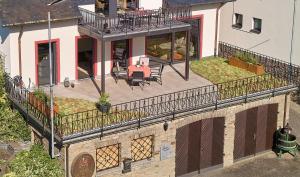 an aerial view of a house with a balcony at Wohnen am Weingut - Über den Fässern in Briedel