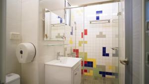 a bathroom with a sink and a toilet at 屏東潮州民宿-綠品文旅Green Inn in Chaozhou +71 photos