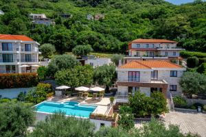 an aerial view of a villa with a swimming pool at Villa Svinjista in Budva