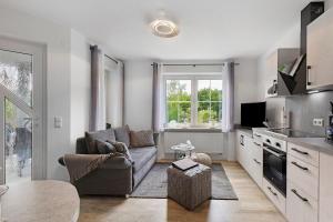 a living room with a couch and a table at Ferienwohnung Griesbaum in Tengen
