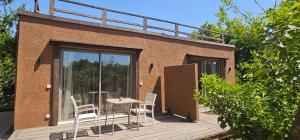 a patio with a table and chairs on a building at Casa Taos in Marrakesh