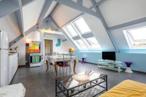 a kitchen and living room with skylights at Domaine de Kerroux in Bannalec