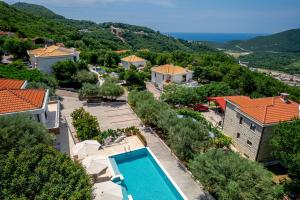 an aerial view of a villa with a swimming pool at Villa Svinjista in Budva +44 photos