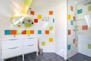 a bathroom with a shower and a mirror at Domaine de Kerroux in Bannalec +75 photos