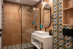 a bathroom with a sink and a shower at RUELLE Chateau Boutique- adults only in Sinaia +111 photos