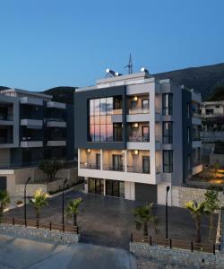 an image of a building with a sunset at Sea La Vie in Vlorë